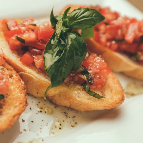 closeup shot of an bruschetta with tomato and basil